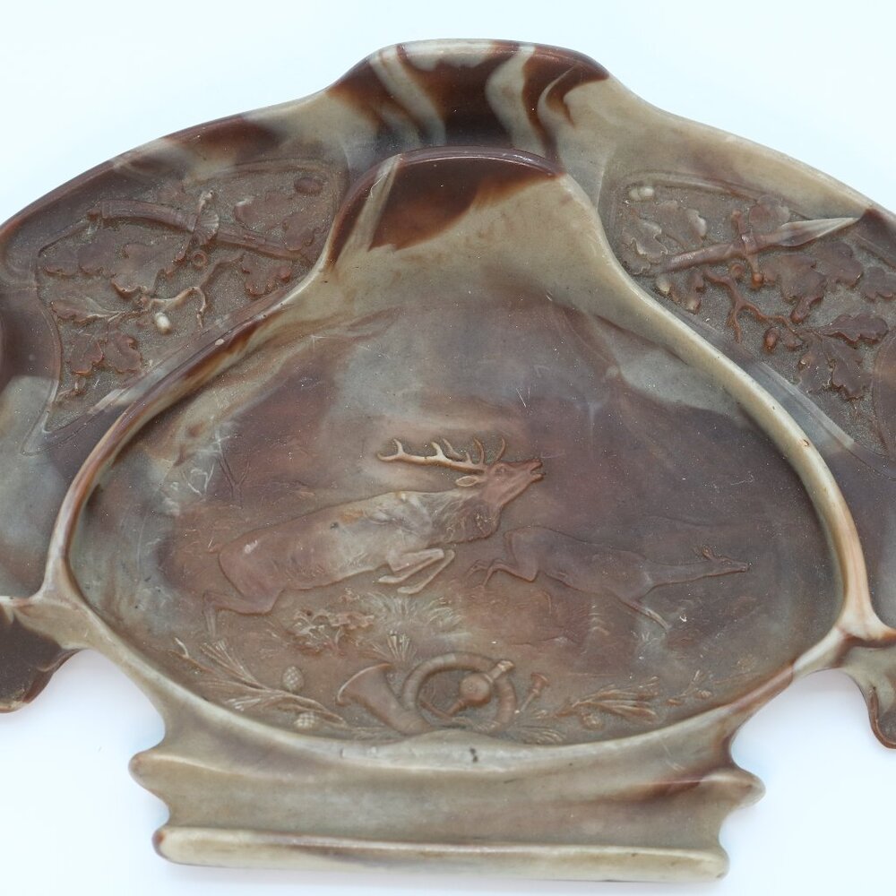 Rustic valet tray (dresser or desk organizer) with a carved hunting scene.